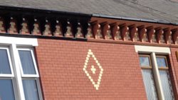 Decorative eaves brackets on a roof.
