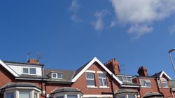 Differently designed roof lifts on a single terraced houses.