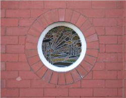Fig. 13 Porthole window with pictorial leaded glass on Beech Avenue