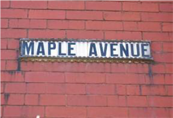 Fig. 19 Early 20th century street name signage, tiled letters in cast-iron frame