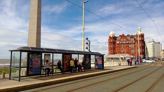 Tram lines with tram stop in distance.