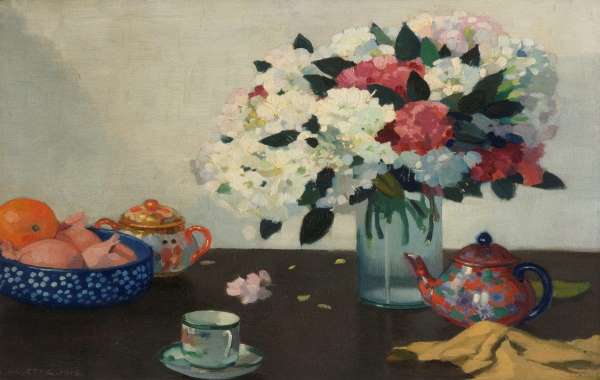 Table, with tea pot, tea cup and flowers 