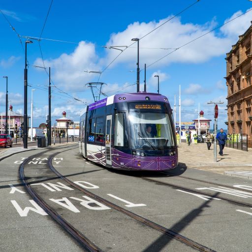 Tram driving through new Blackpool North station extension
