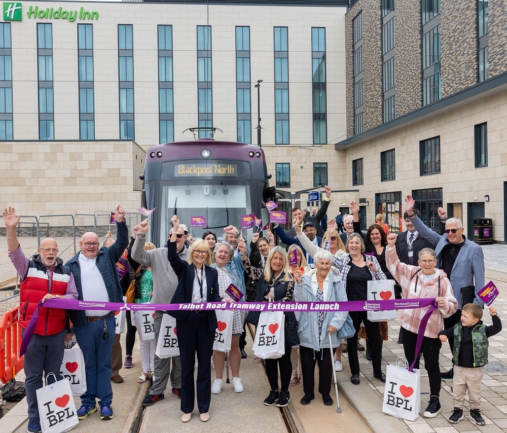 Jane Cole Managing Director of Blackpool Transport and competition winners at the new Blackpool North tram stop