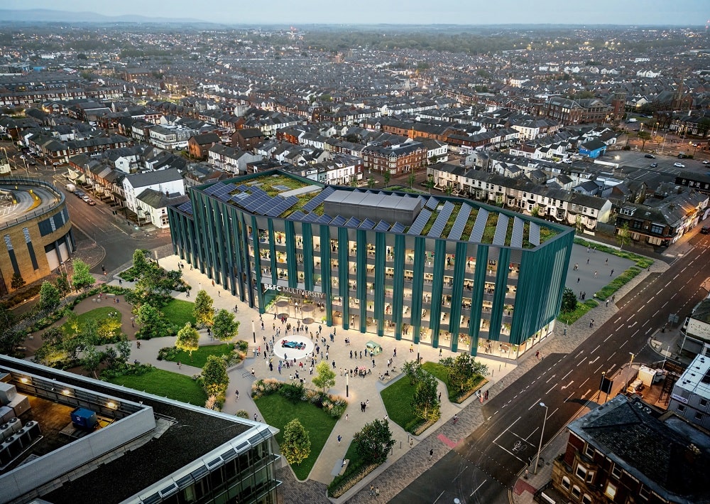 Teal green building with a landscaped public area in front