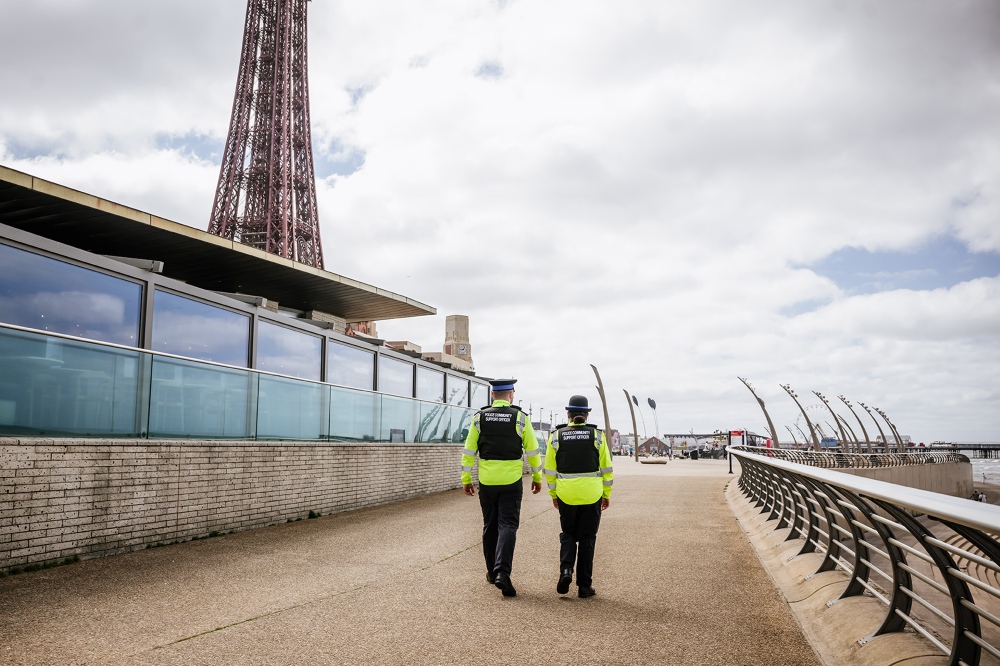 Police officers walking along the promenade in Blackpool