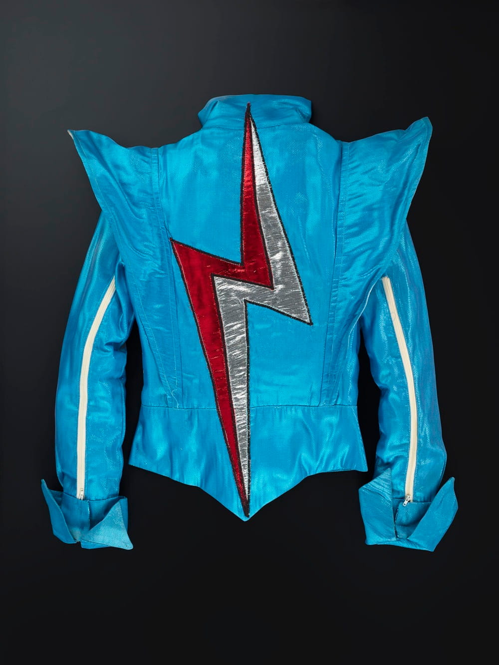 Back of a blue jacket with red and silver flash.