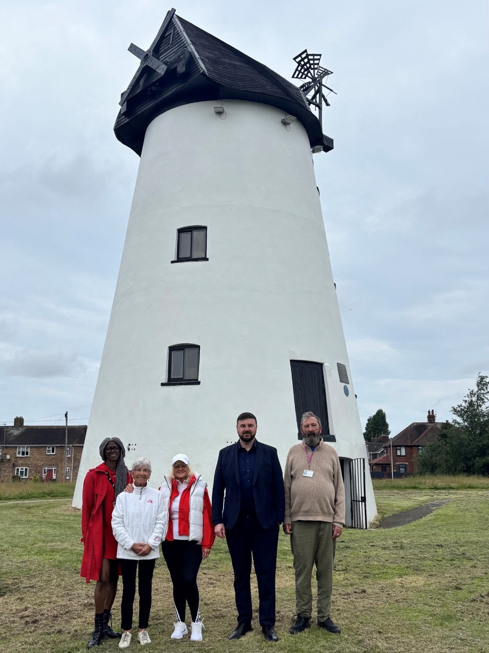 Members of the community outside Little Marton Windmill