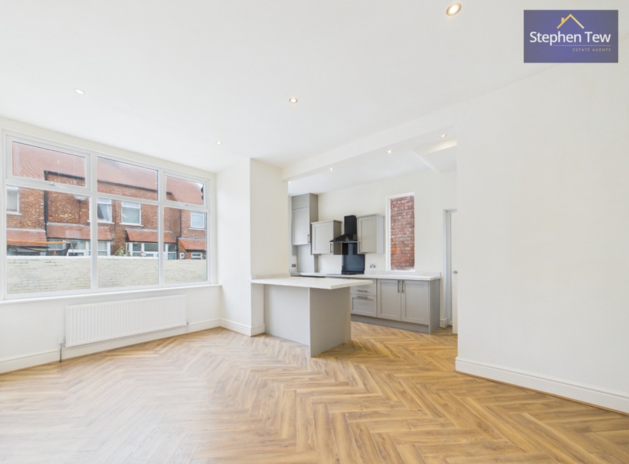 Image shows a newly renovated, open plan living area