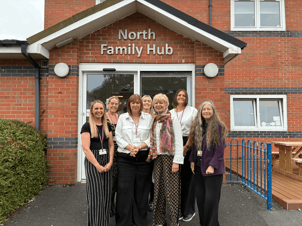 Staff and Sue Robb gathered outside North Family Hub