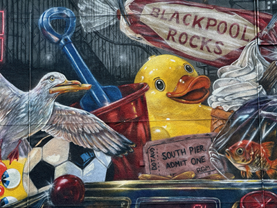 A close up of a street artwork, showing items and landmarks from Blackpool