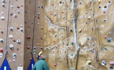 Climbing wall at Blackpool sports centre with an instructor holding a rope