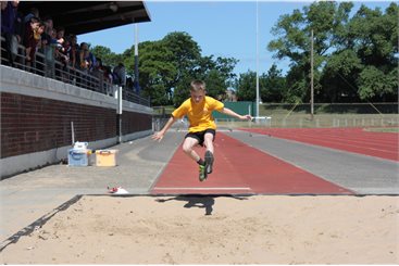 Boy doing the long jump at Blackpool Sports Centre