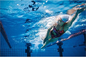 Tile - Adult Learn 2 swim. Lady swimming