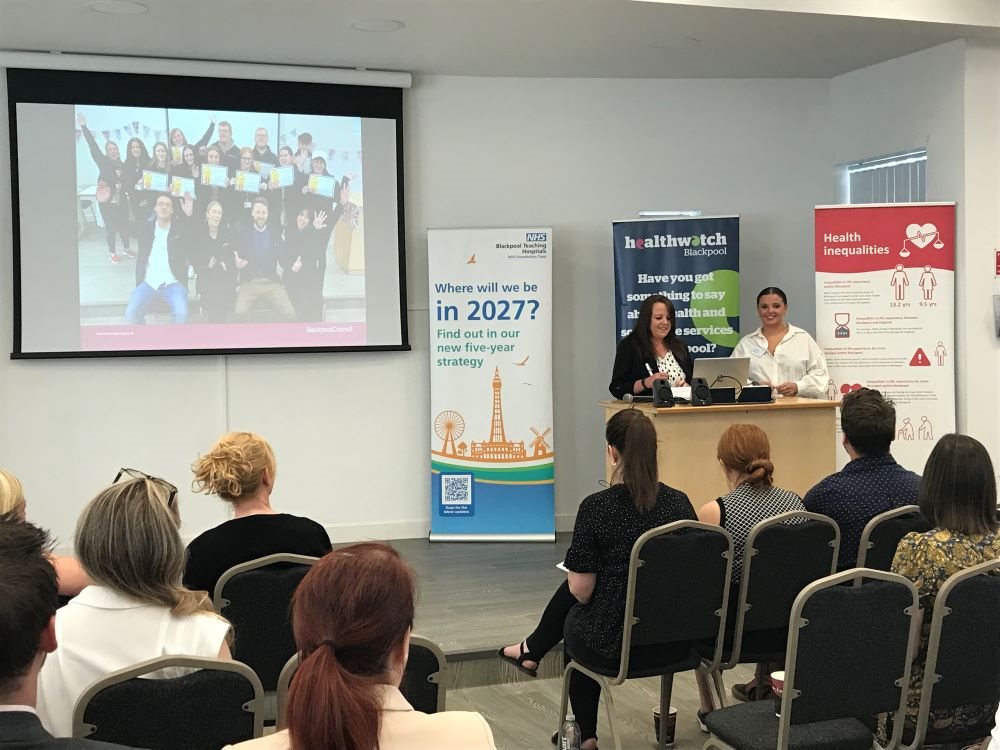 Blackpool Researching Together Launch Event image showing participants seated while the presenters address the room.