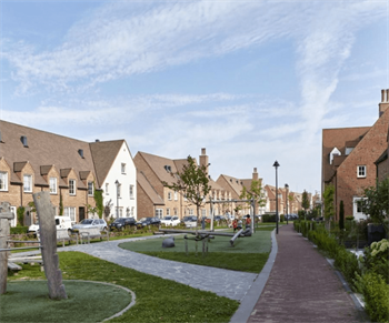 Terraced housing with green spaces.