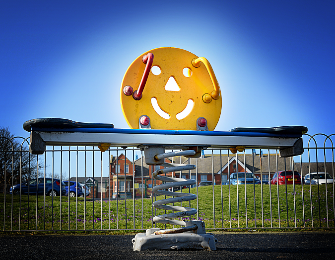 Seesaw with smiley face.
