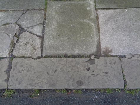An example of Concrete flags with natural stone kerbs