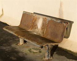 Rusting bench on the promenade