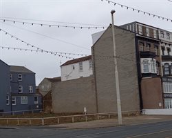 Unattractive gap site formerly the Ambassador Hotel