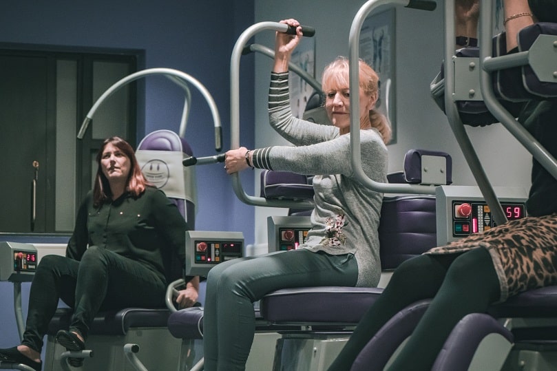 Woman sat on exercise equipment