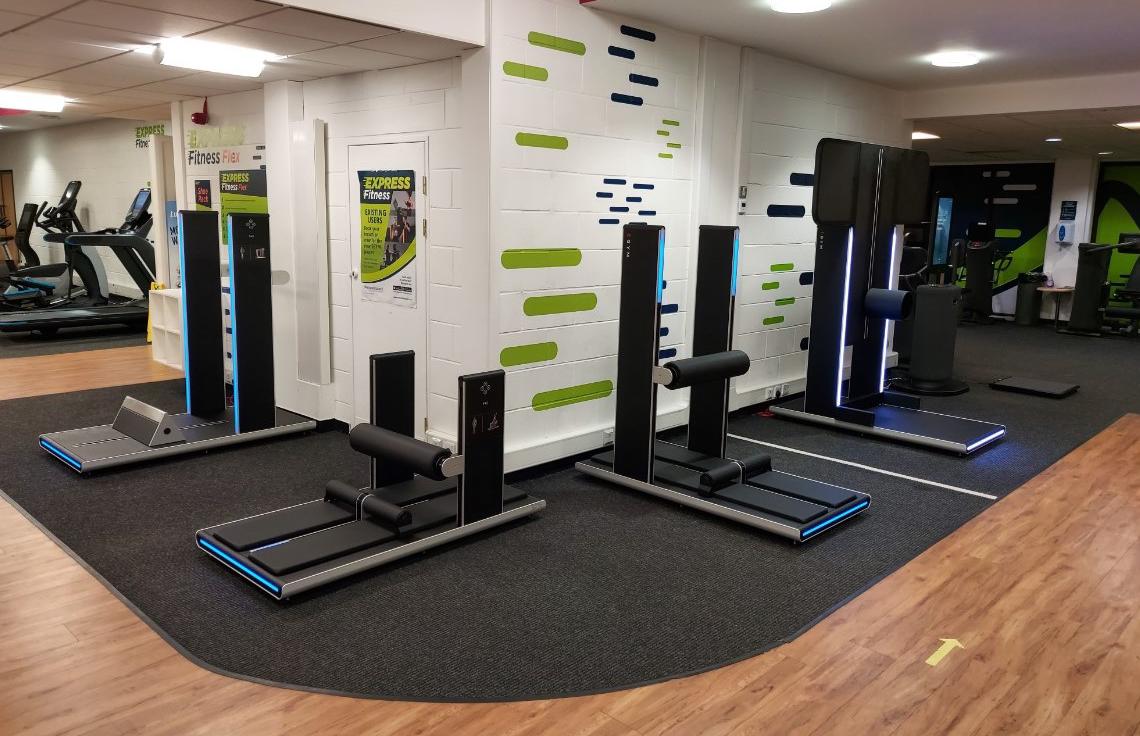 Express fitness Flex machines set up in a row round a corner in the gym