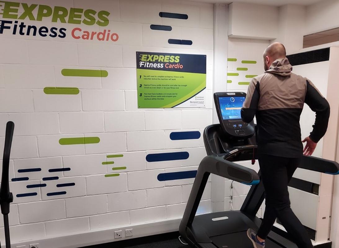 Man running on the Express fitness Cardio machine
