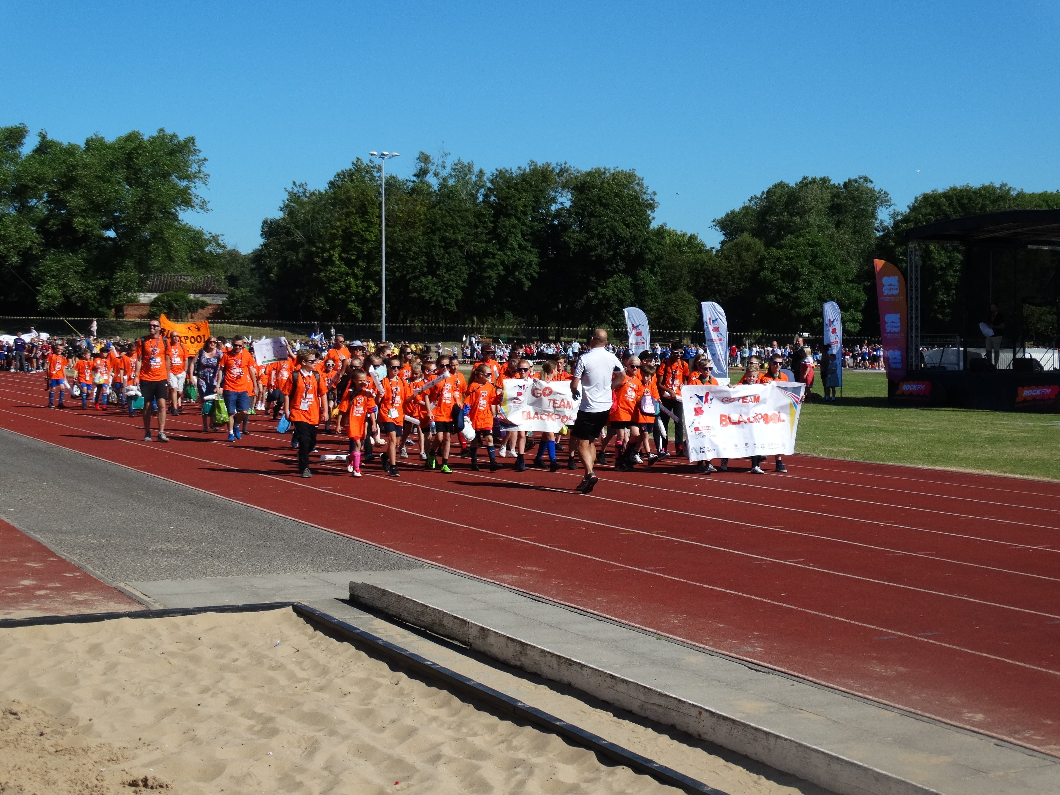 Group parade round the track at Blackpool Sports Centre