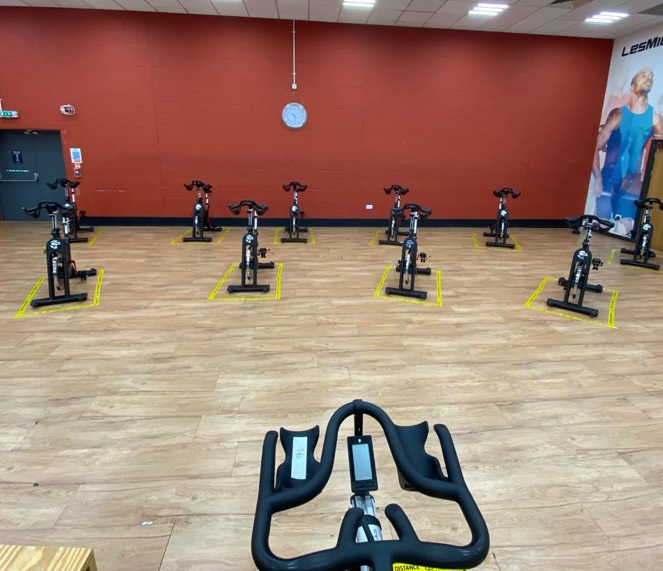 View from the spin instructors seat looking at spin bikes socially distanced