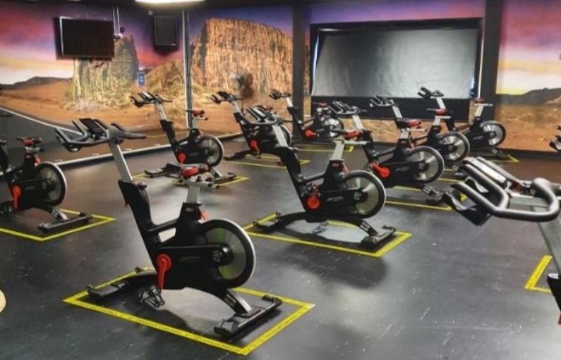 Spin studio at Blackpool sports centre with spin bikes in rows with floor tape around the bikes