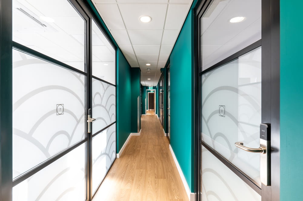 Corridor with doors to meeting rooms at The Robinson.