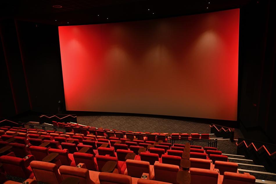 Cinema with giant iMax screen lit in red