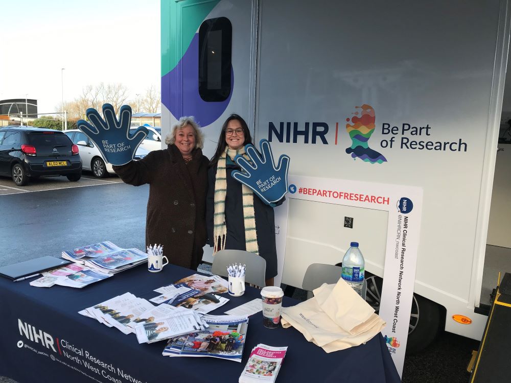 Two team members from Blackpool Researching Together set up for community engagement at the NIHR mobile research van